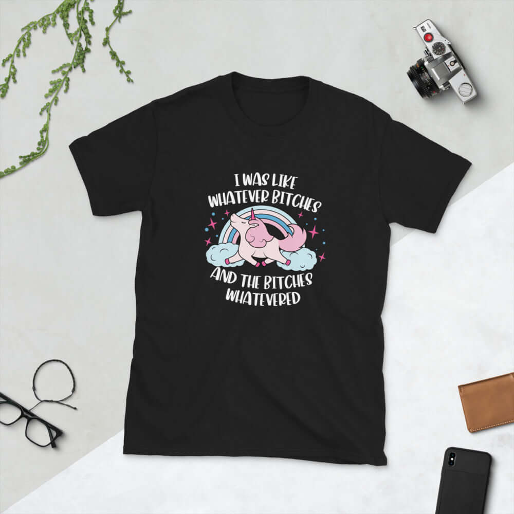 Black t-shirt with a prancing unicorn rainbow graphic. The phrase I was like whatever bitches and the bitches whatevered printed on the front.