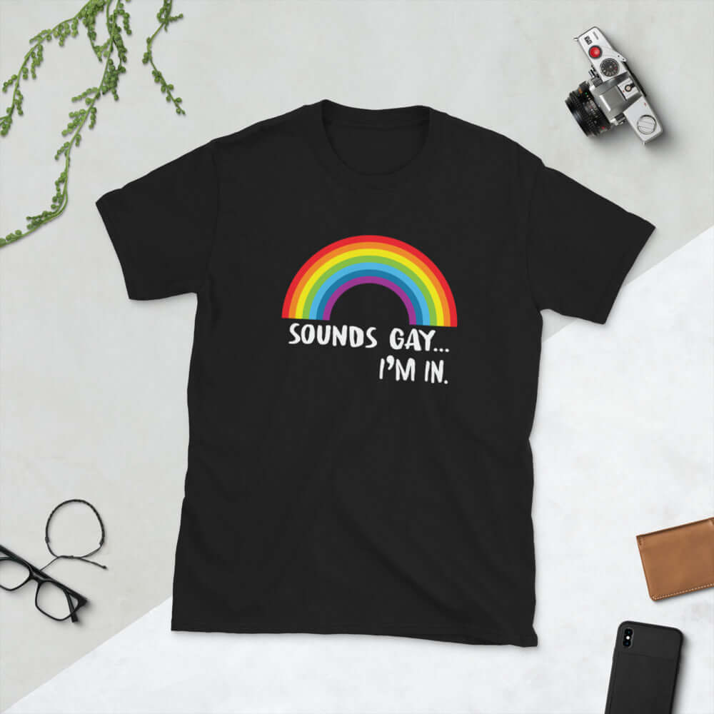 Black t-shirt that has an image of a rainbow and the phrase Sounds gay, I'm in printed on the front