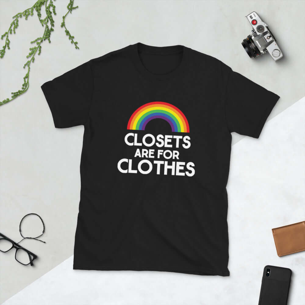 Black t-shirt with a rainbow and the words Clothes are for closets printed on the front.