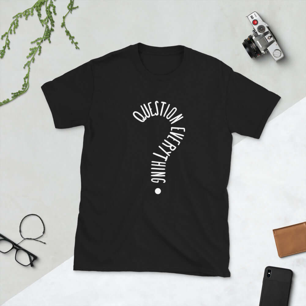 Black t-shirt with the words Question everything printed on the front. The words are in the shape of a question mark.