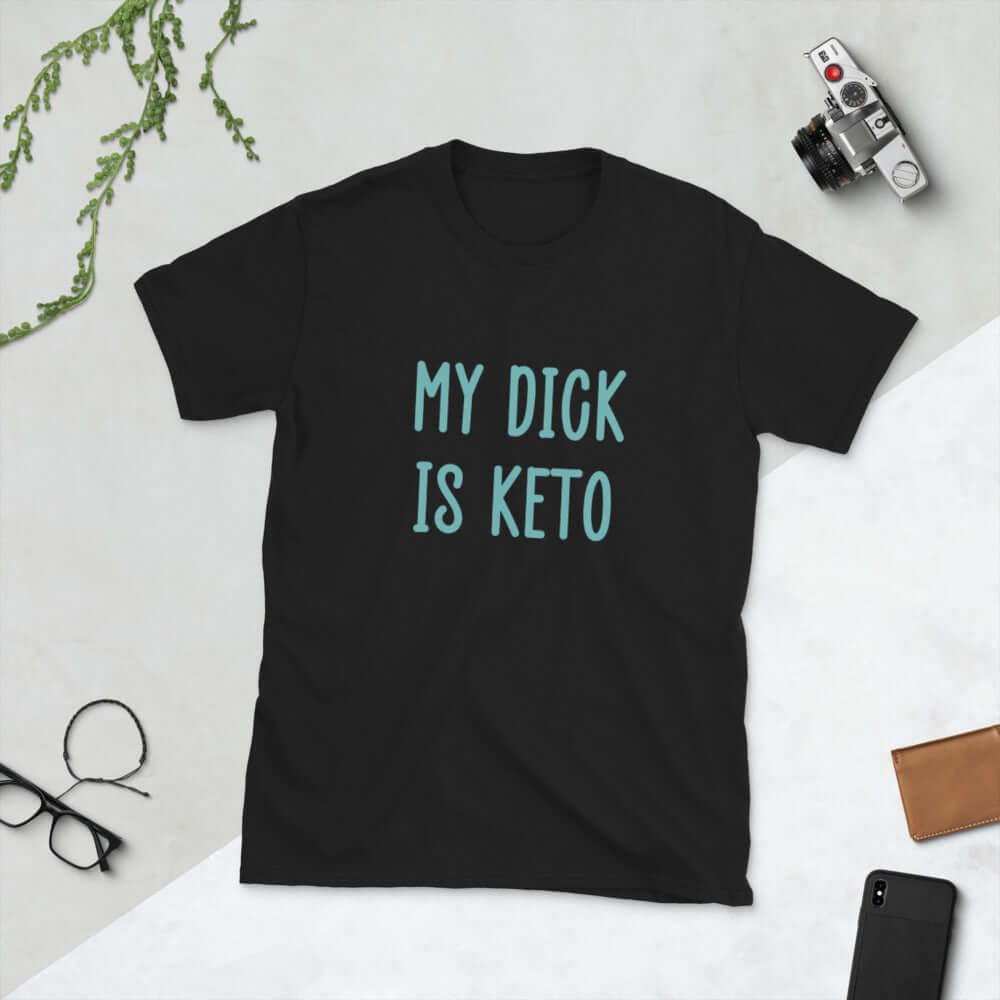 Black t-shirt with the phrase My dick is keto printed on the front in turquoise font.