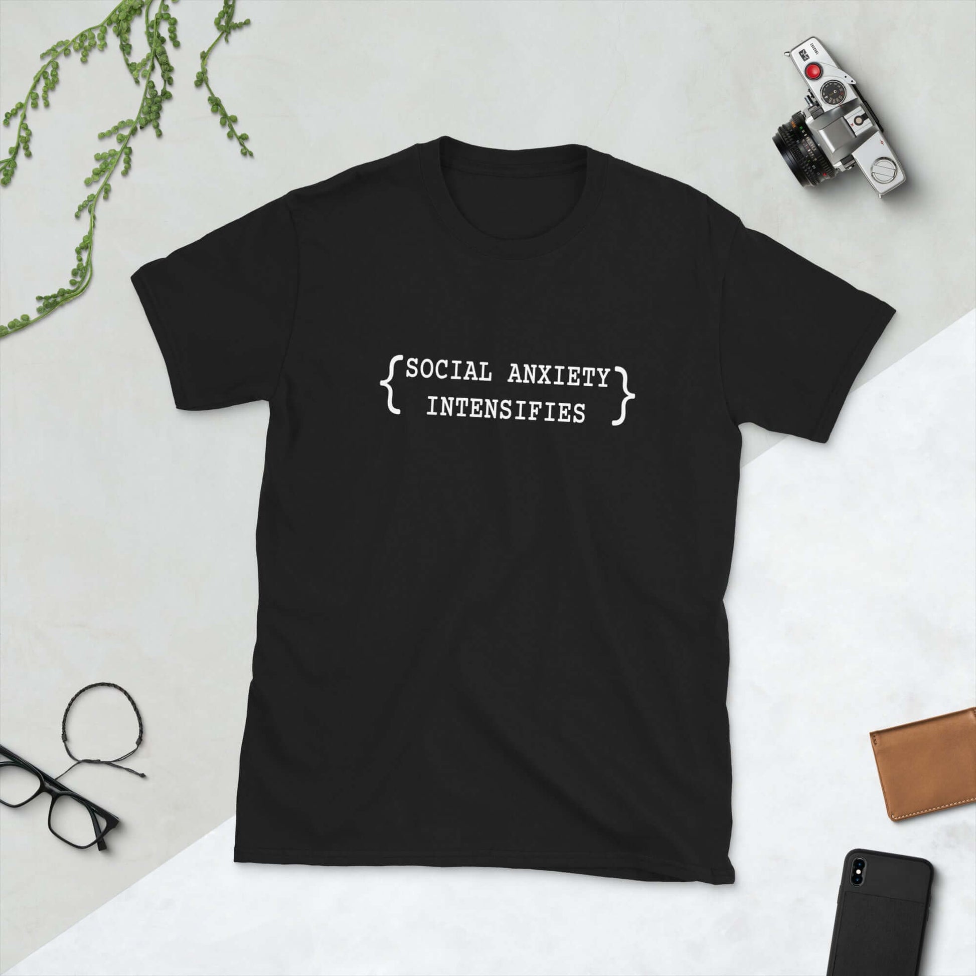 Black t-shirt with the words Social anxiety intensifies printed on the front.