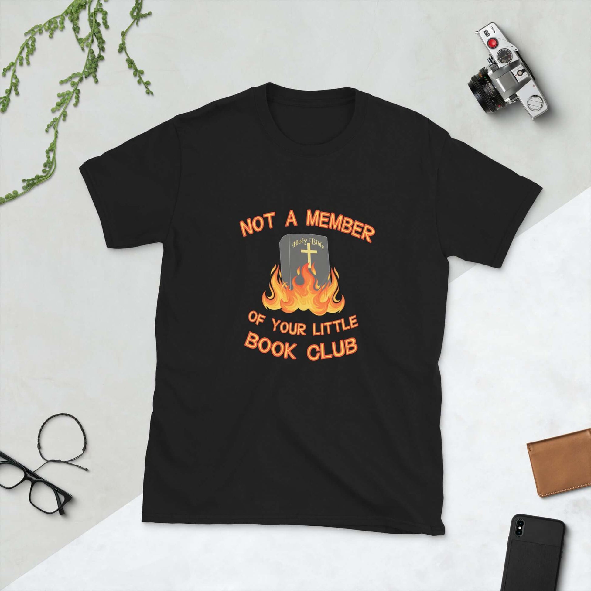 Black t-shirt with image of a burning bible and the words Not a member of your little book club printed on the front.