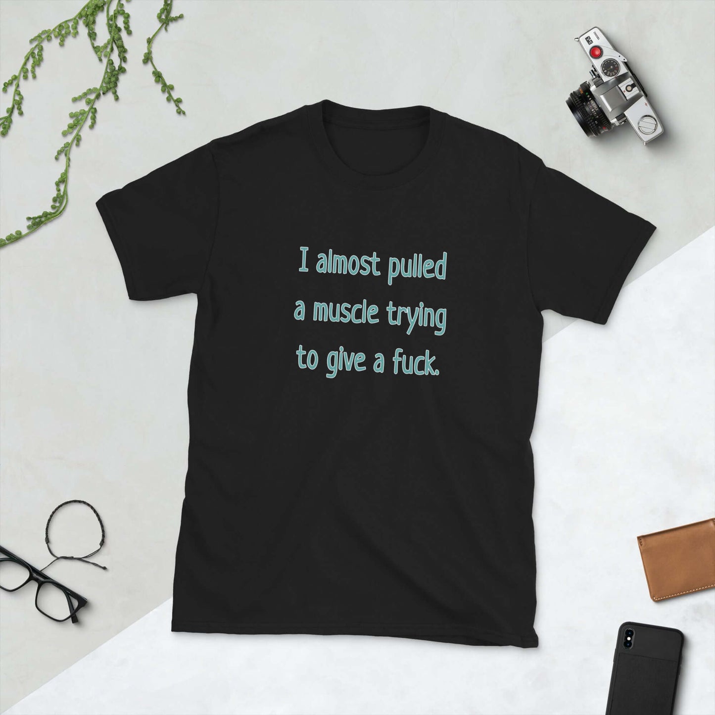 black tshirt that says I Almost pulled a muscle trying to give a fuck by witticismsrus.com