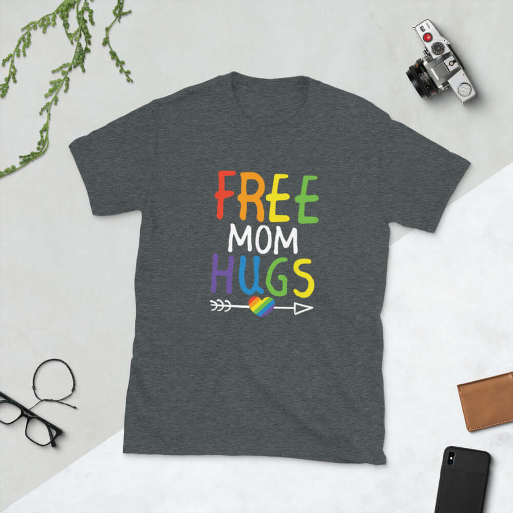 Dark grey t-shirt with the words Free Mom hugs in rainbow lettering printed on the front.