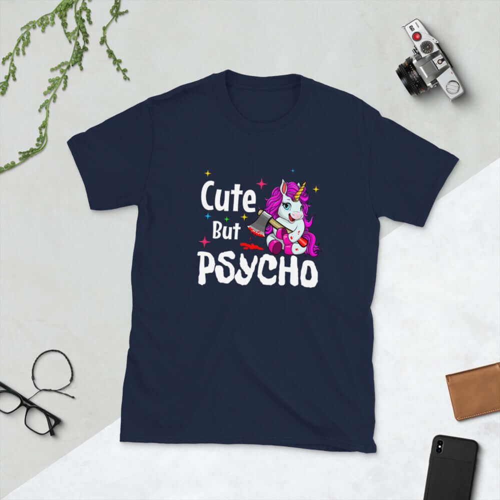 Navy blue t-shirt that has a graphic of a unicorn holding a knife & the words Cute but psycho printed on the front.