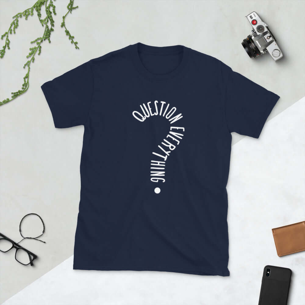 Navy blue t-shirt with the words Question everything printed on the front. The words are in the shape of a question mark.