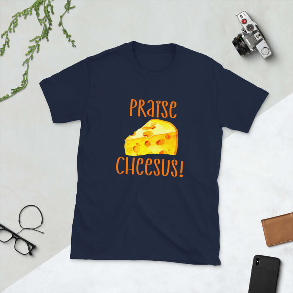 Navy blue t-shirt with funny graphics of a piece of swiss cheese and the words Praise Cheesus printed on the front of the hoodie in yellow and orange.