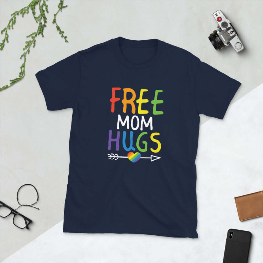 Navy blue t-shirt with the words Free Mom hugs in rainbow lettering printed on the front.