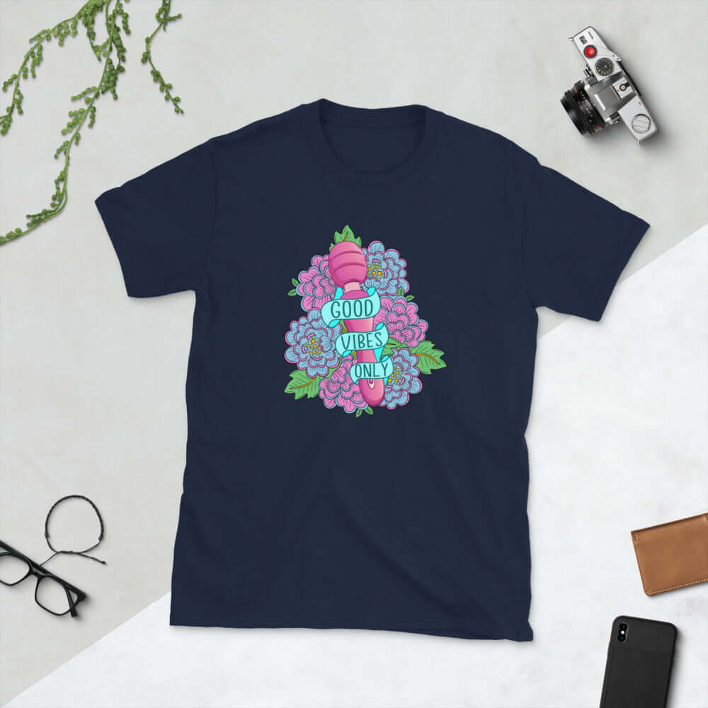 Navy blue t-shirt with graphic design that has the words Good vibes only layered over a pink wand vibrator with flowers around. The graphic design is printed on the front of the shirt.