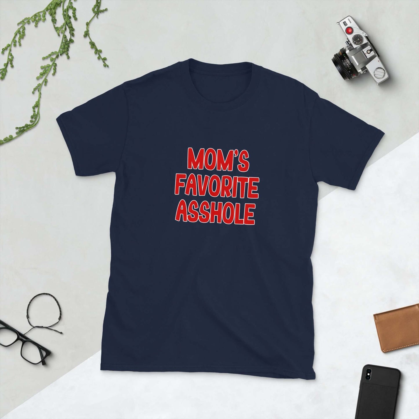 Navy blue t-shirt with the words Mom's favorite asshole printed in red on the front. 