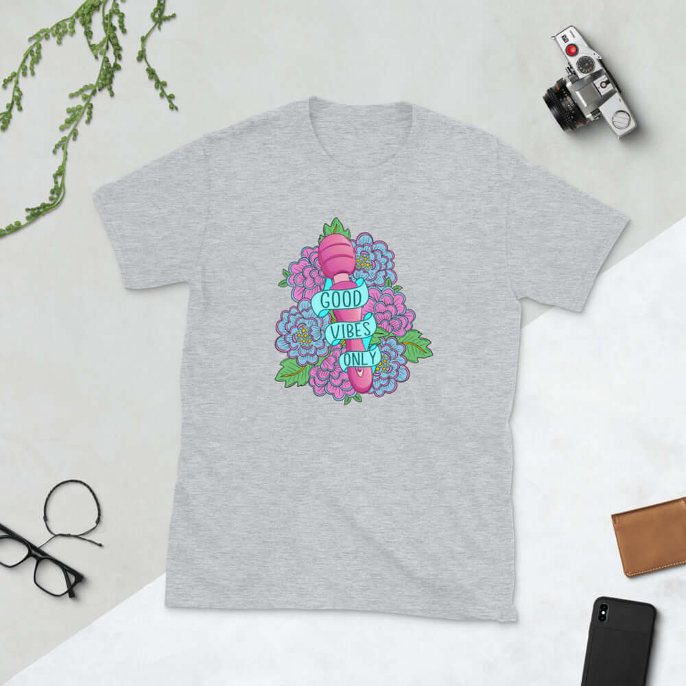 Light grey t-shirt with graphic design that has the words Good vibes only layered over a pink wand vibrator with flowers around. The graphic design is printed on the front of the shirt.