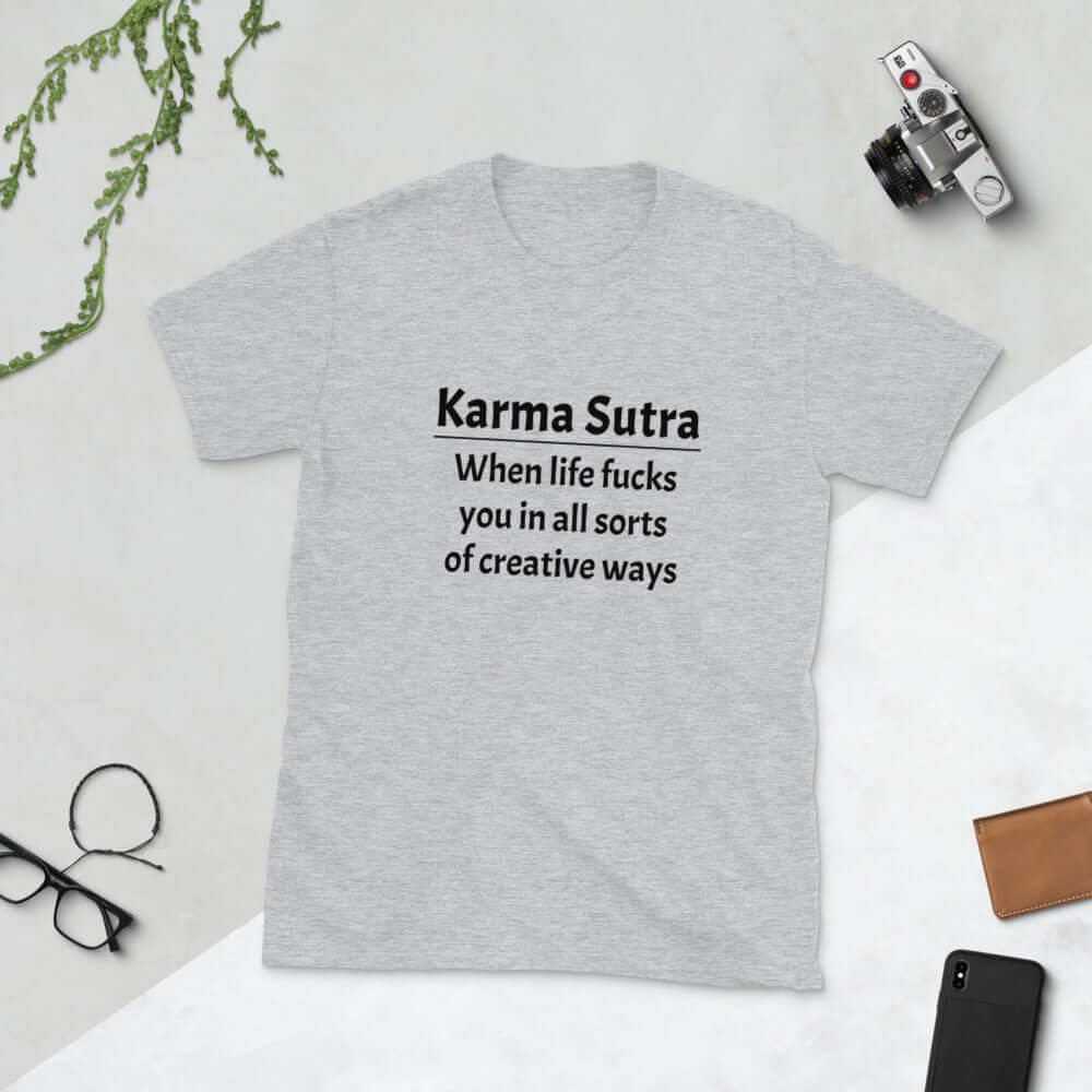 Light grey t-shirt with the funny phrase Karma sutra, when life fucks you in all sorts of creative ways printed on the front.