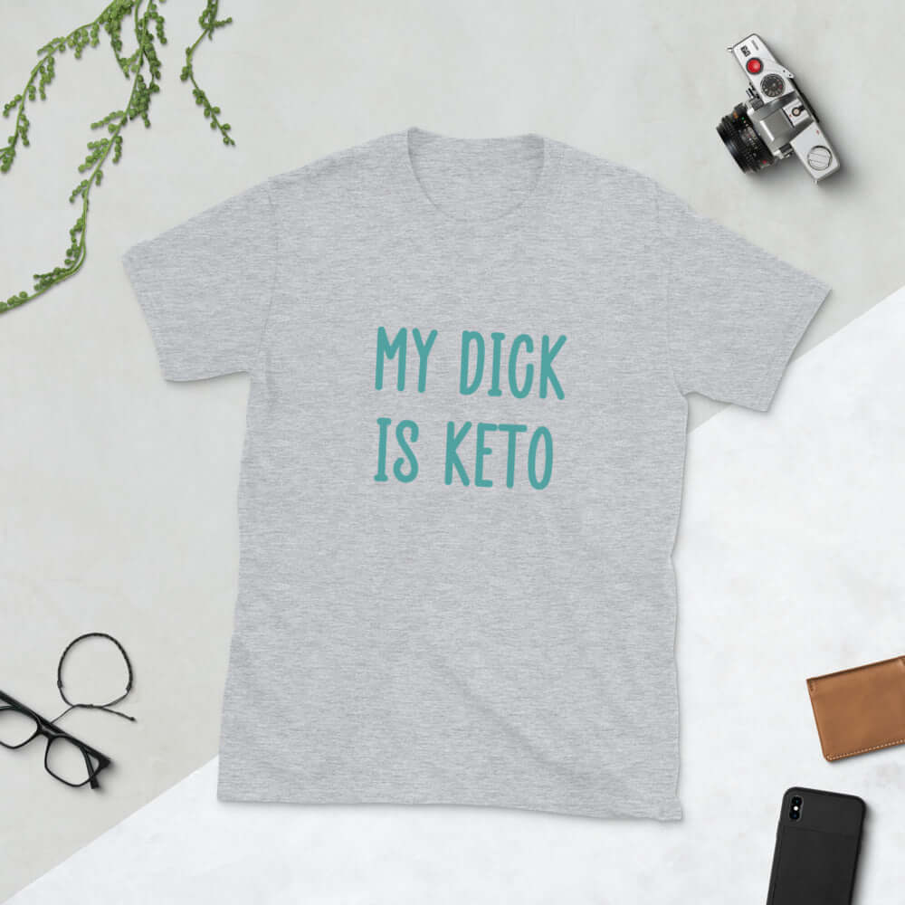 Light sport grey t-shirt with the phrase My dick is keto printed on the front in turquoise font.