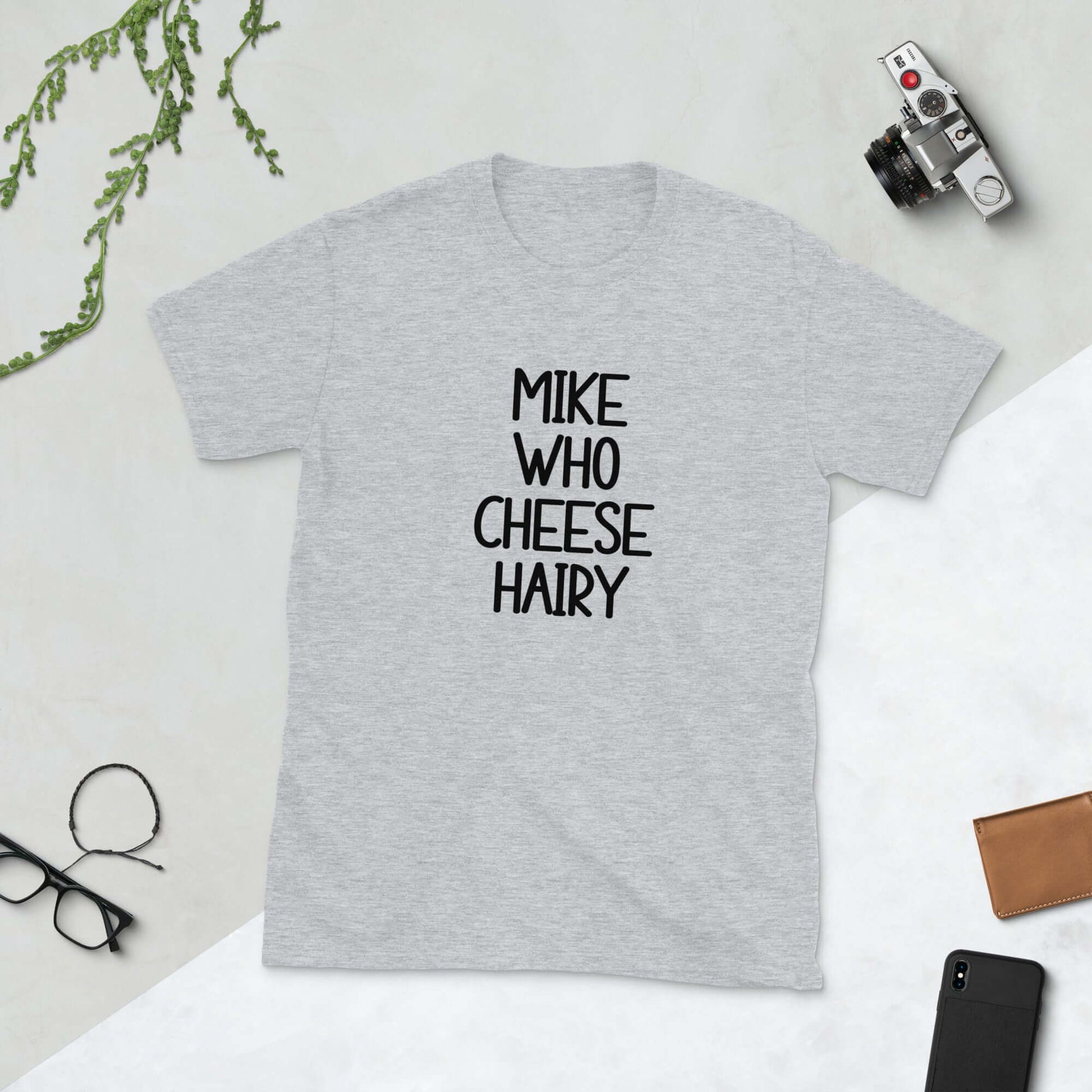 Light grey pun t-shirt with the words Mike who cheese hairy printed on the front.