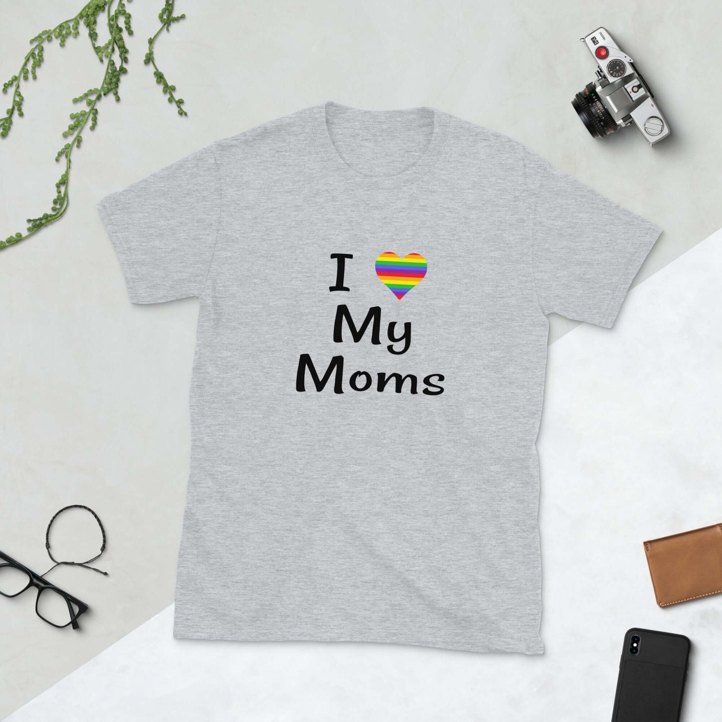 Light grey t-shirt with I heart my moms printed on the front. The heart is rainbow colors.