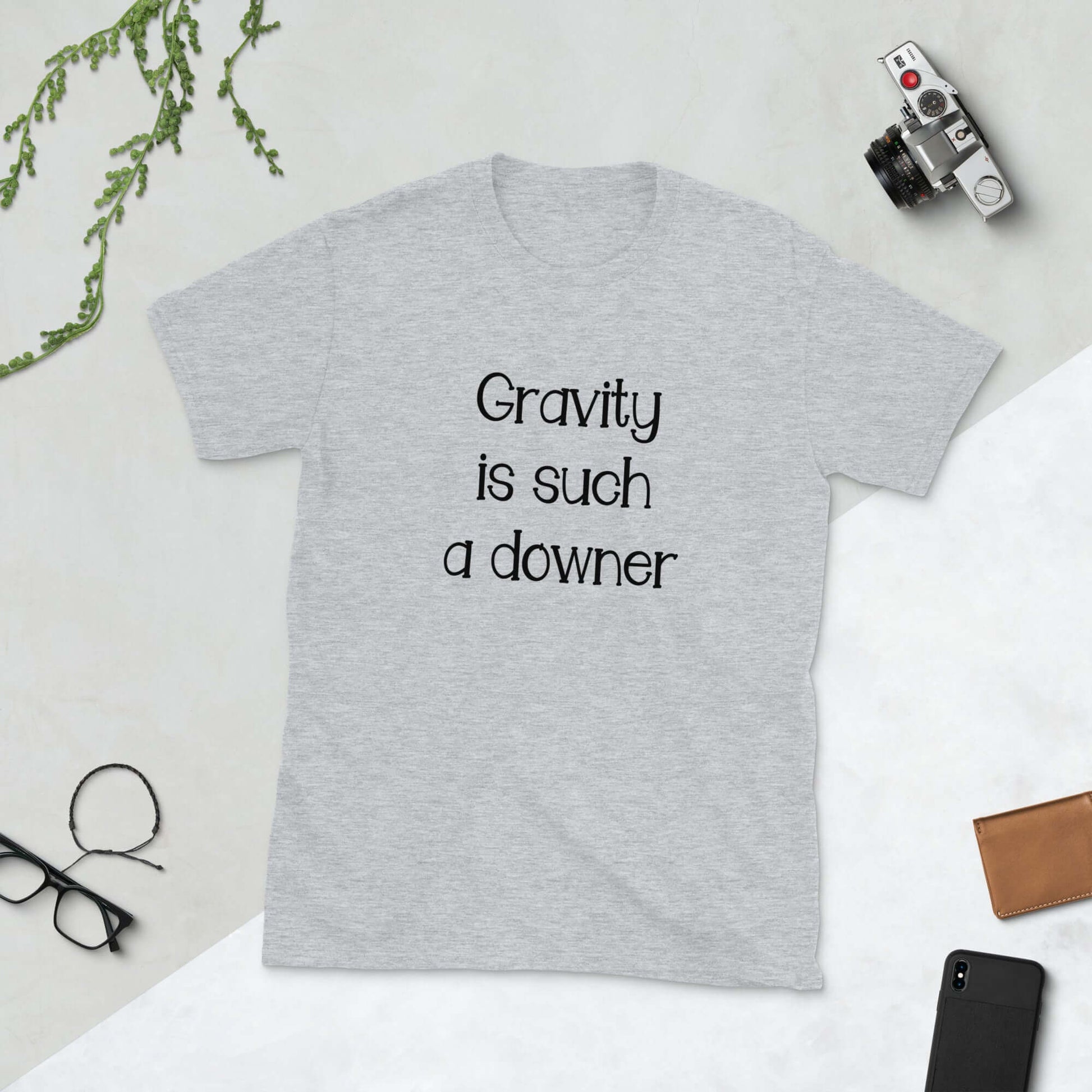 Sport grey t-shirt with the words Gravity is such a downer printed on the front.