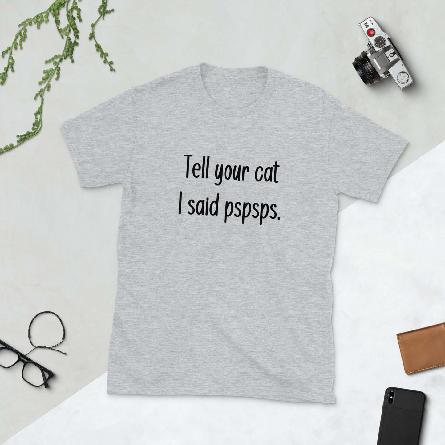 Light grey t-shirt with the words Tell your cat I said pspsps printed on the front.