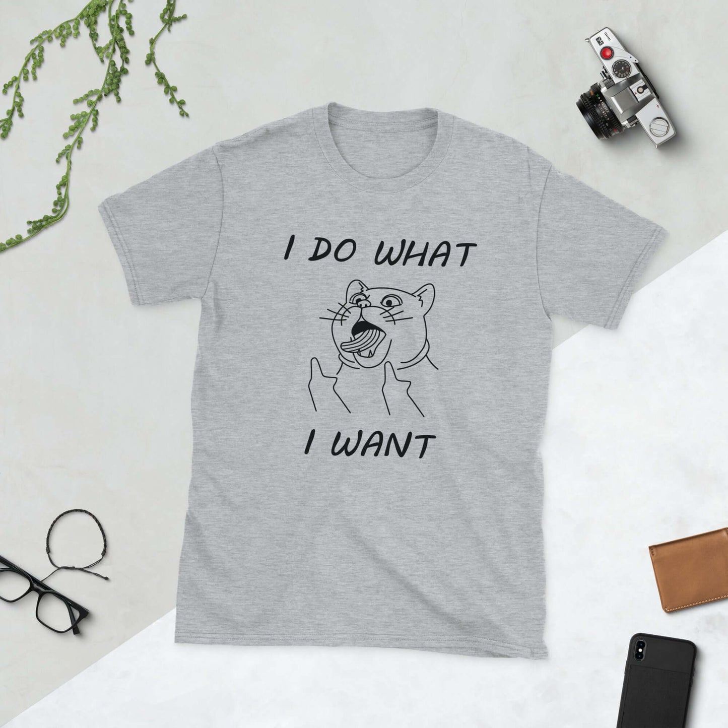 Light grey t-shirt with cat flipping middle fingers and the words I do what I want printed on the front.