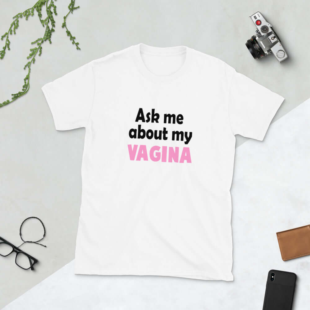 White t-shirt with the words Ask me about my vagina printed on the front. The word vagina is printed in pink. The rest of the text is black.