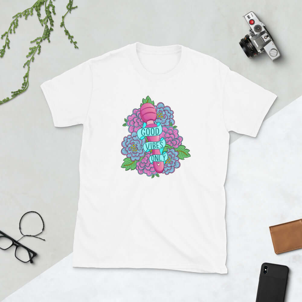 White t-shirt with graphic design that has the words Good vibes only layered over a pink wand vibrator with flowers around. The graphic design is printed on the front of the shirt.