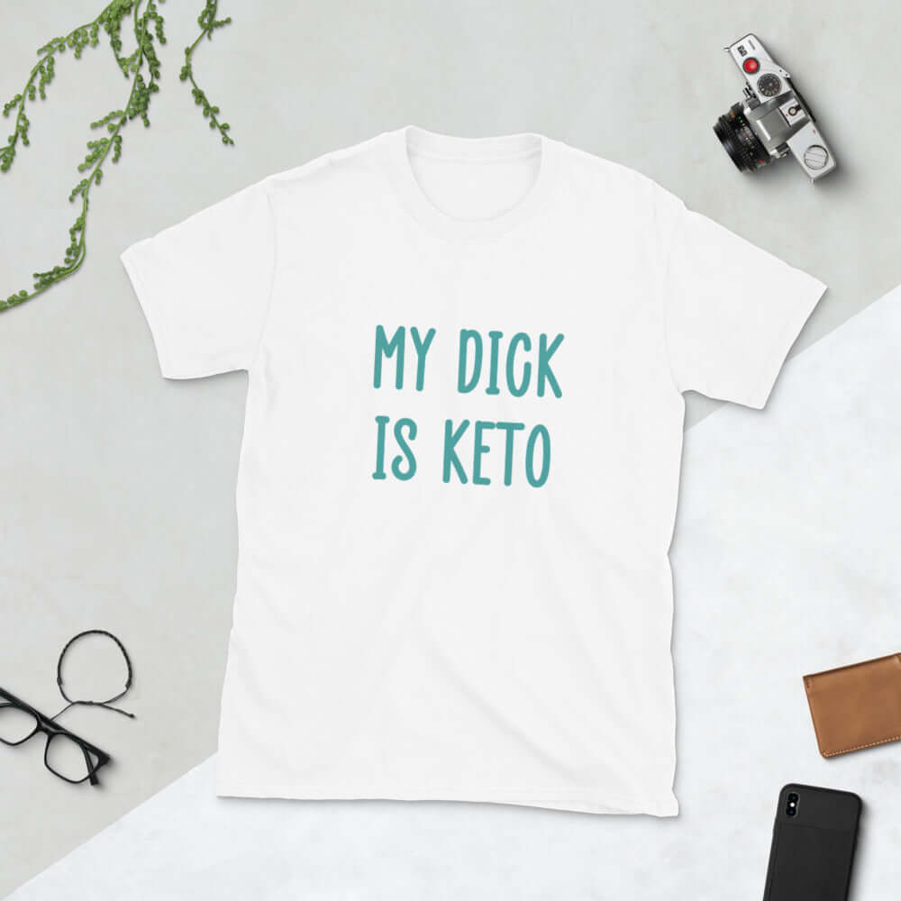 White t-shirt with the phrase My dick is keto printed on the front in turquoise font.