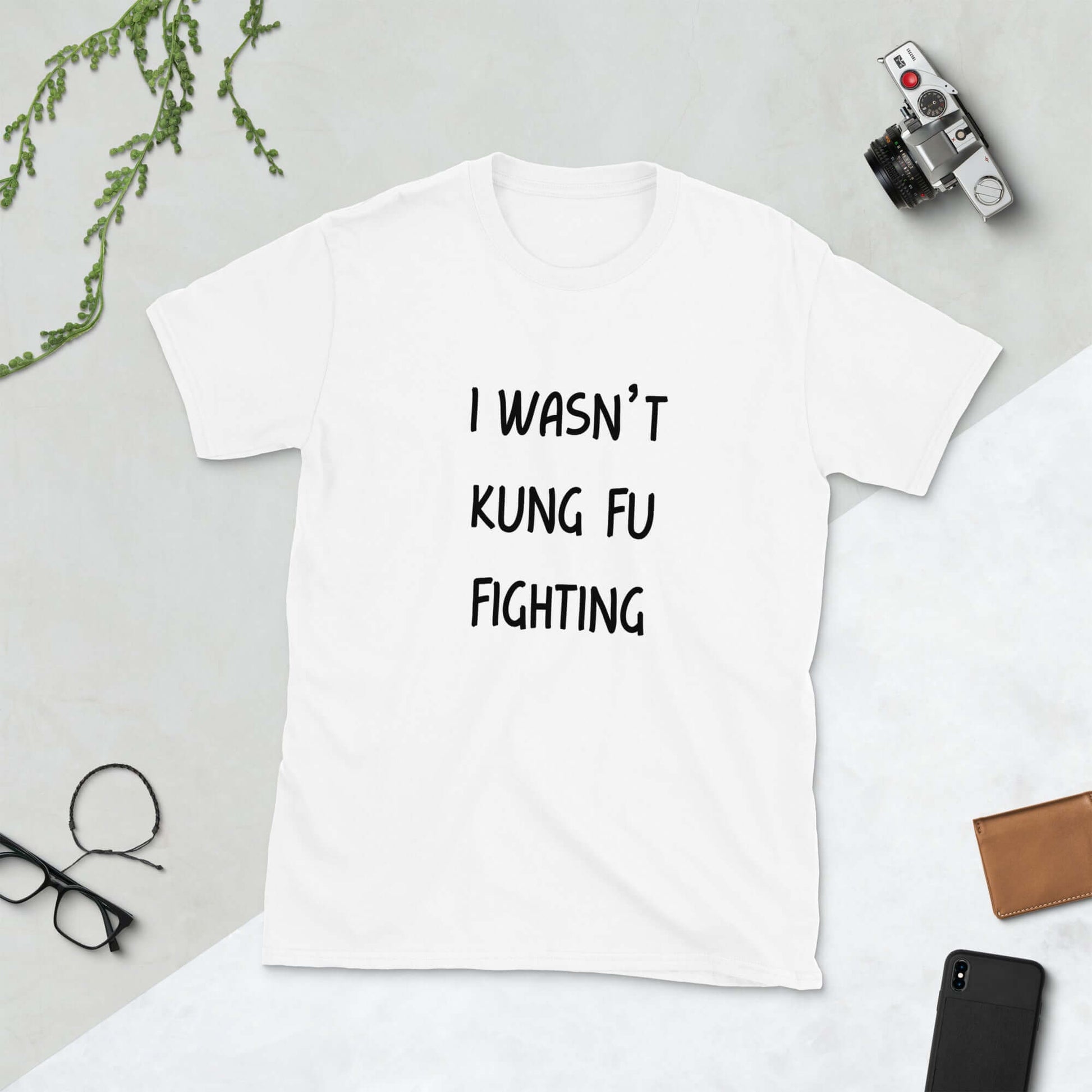 White t-shirt with the funny phrase I wasn't kung fu fighting printed on the front.