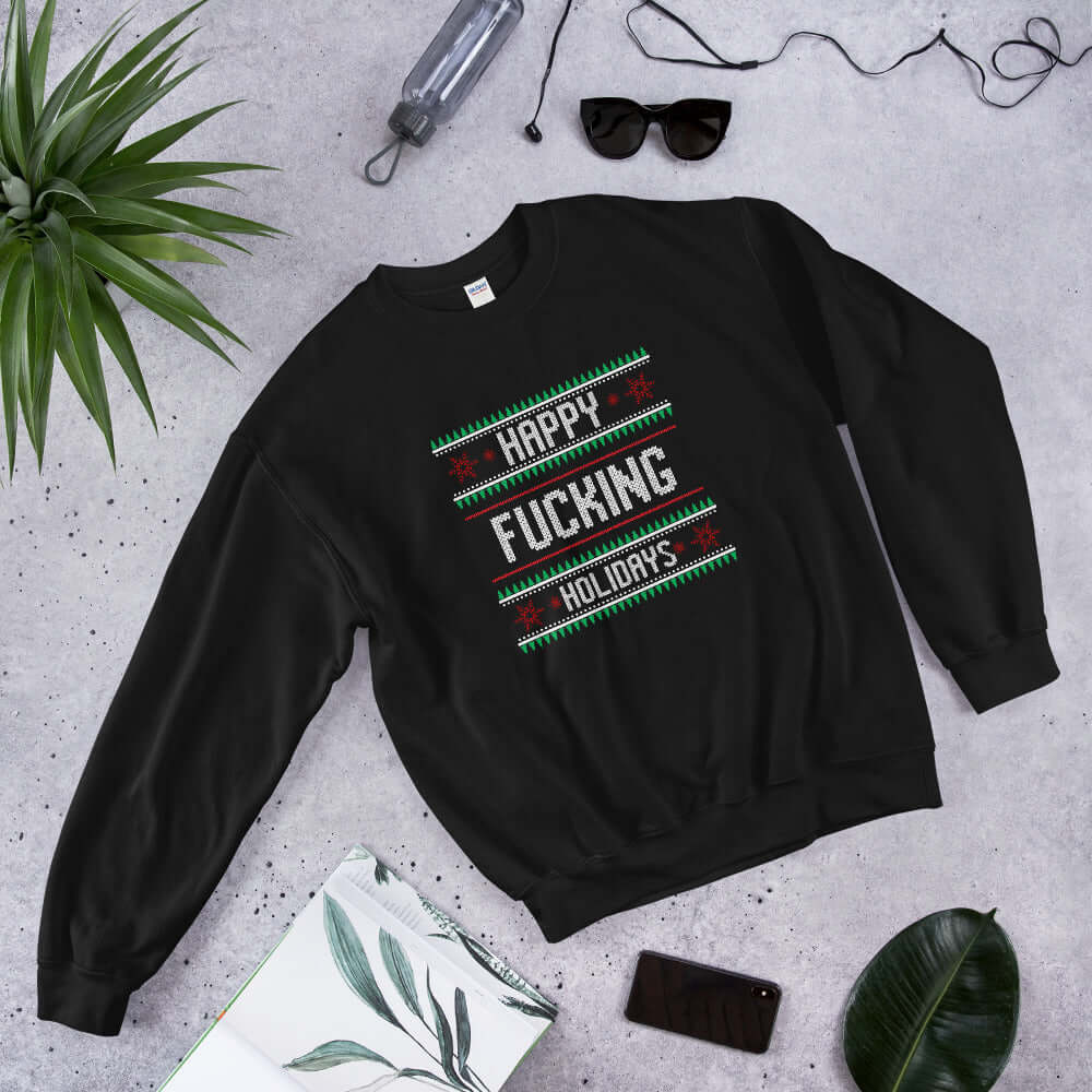 Black crewneck sweatshirt with the phrase Happy fucking holidays printed on the front. 