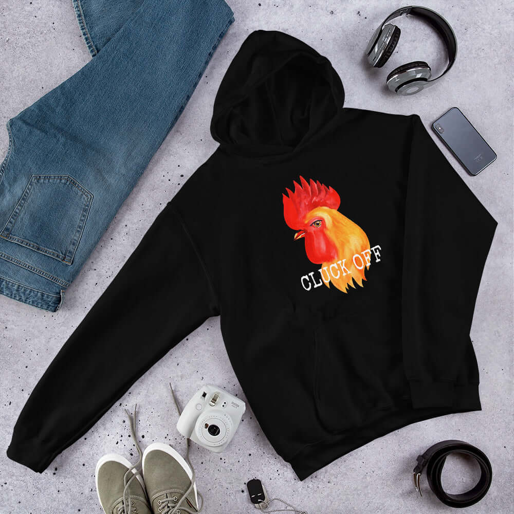 Black pun hoodie sweatshirt that has graphic of a chicken and the words Cluck off printed on the front.