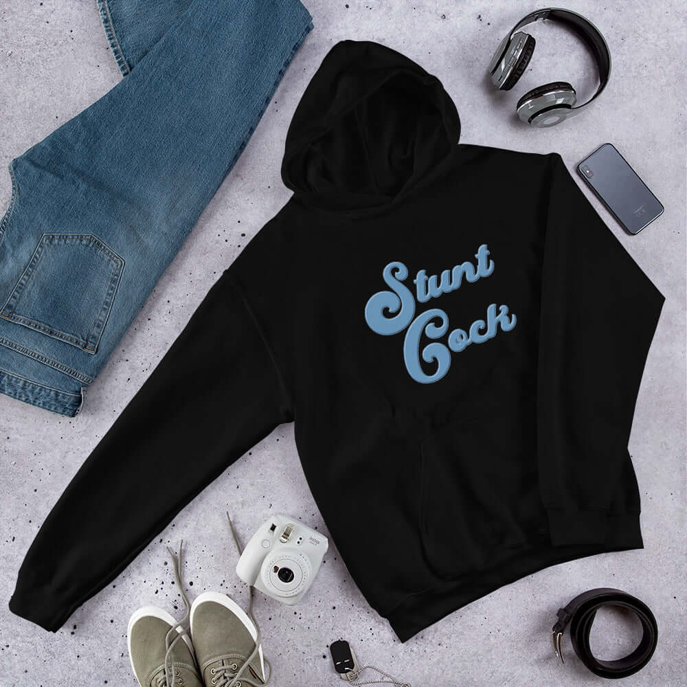 Black hooded sweatshirt with the words Stunt Cock printed on the front in blue.