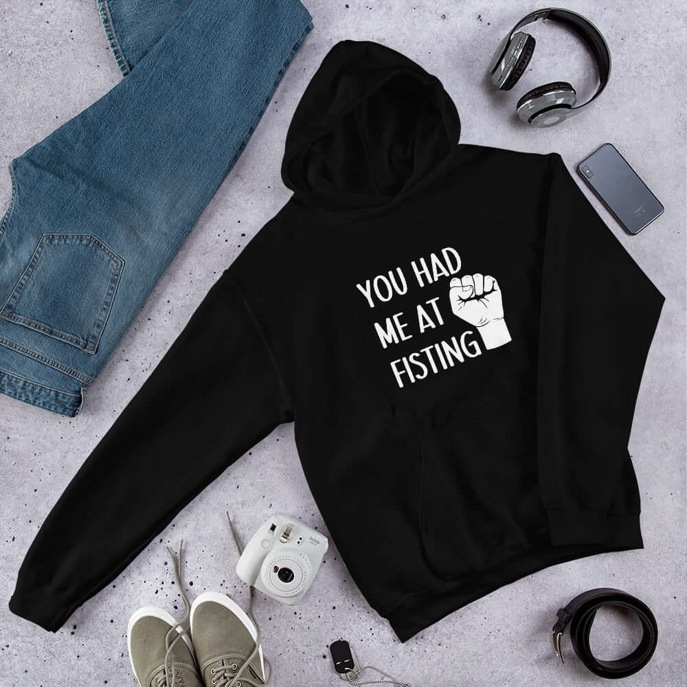 Black hooded sweatshirt with image of a fist and the words You had me at fisting printed on the front.