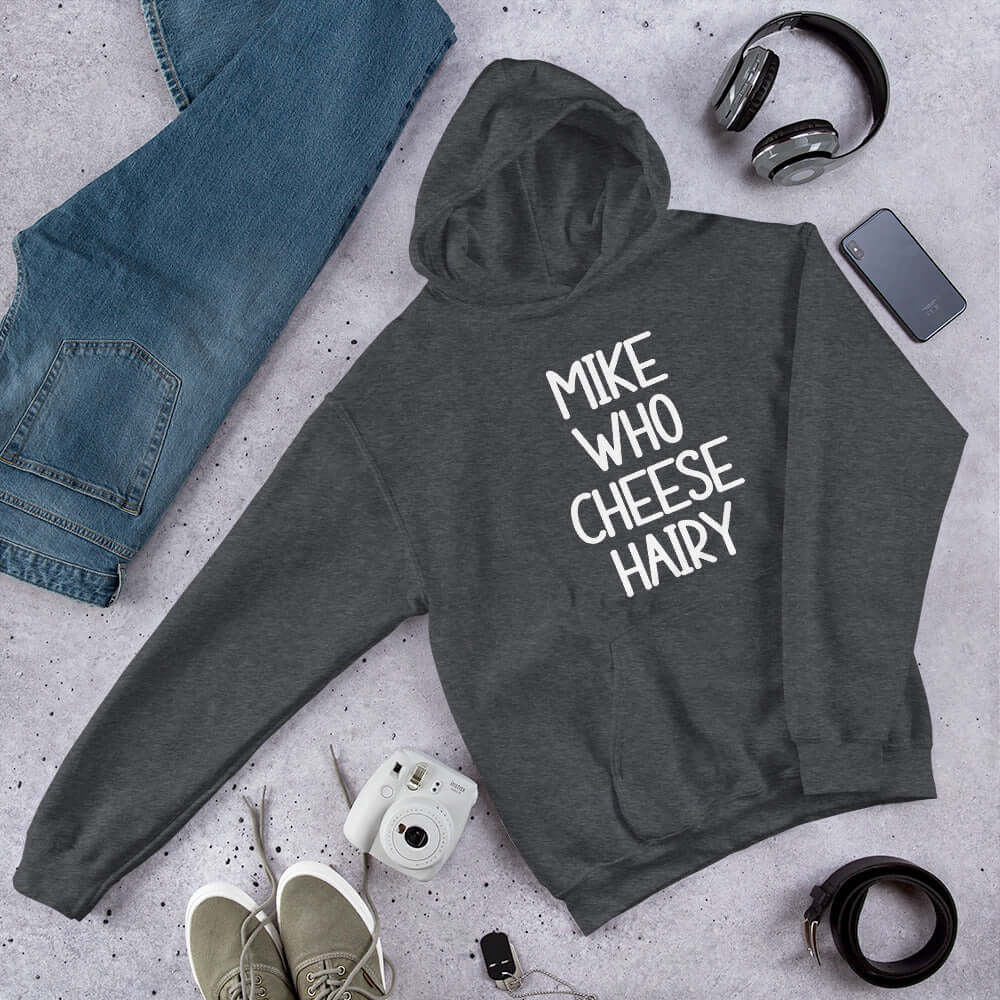 Dark grey pun hoodie sweatshirt with the words Mike who cheese hairy printed on the front.