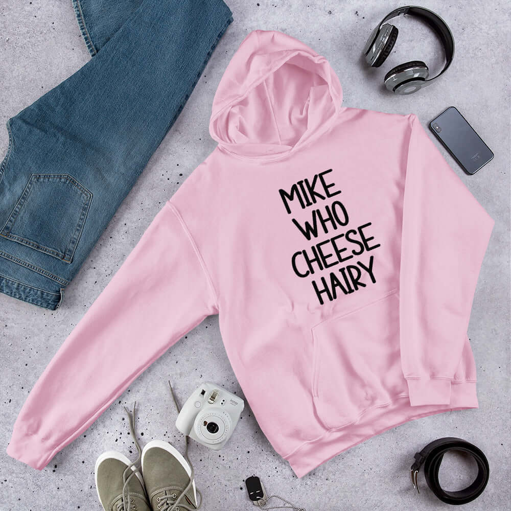 Light pink pun hoodie sweatshirt with the words Mike who cheese hairy printed on the front.