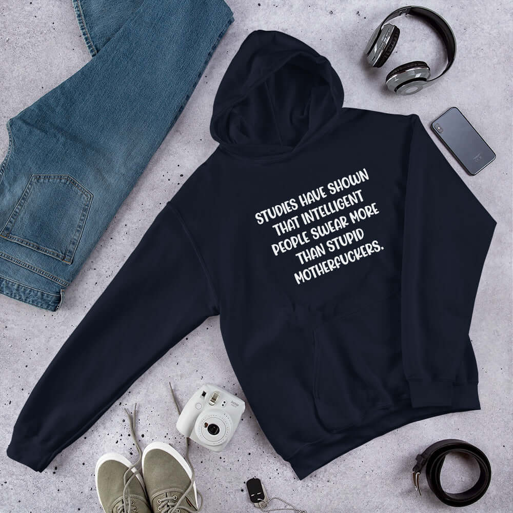 Navy blue hoodie sweatshirt with the funny phrase Studies have shown that intelligent people swear more than stupid motherfuckers printed on the front.