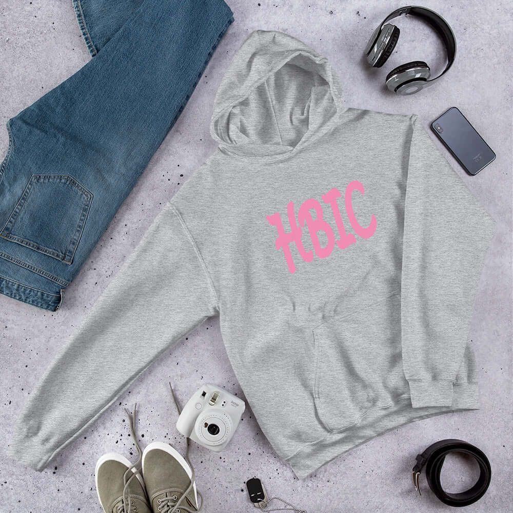 Light grey hooded sweatshirt with the acronym HBIC printed on the front in pink text.