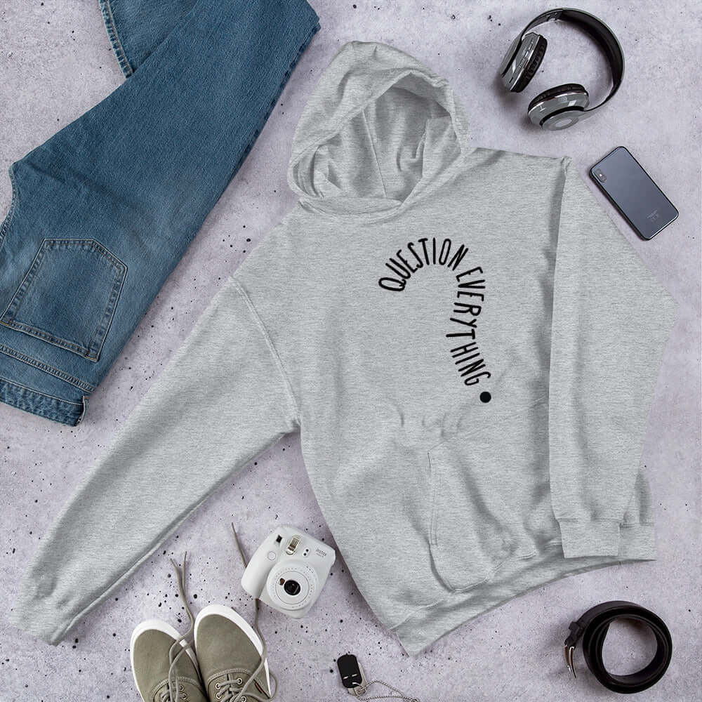 Light sport grey hoodie sweatshirt with the words Question everything printed on the front. The words are in the shape of a question mark.