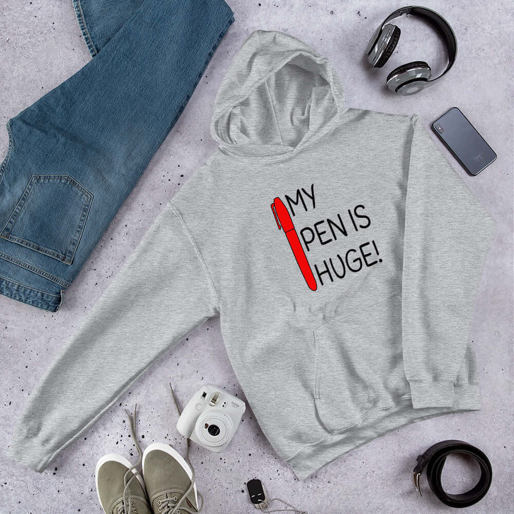 Sport grey hoodie sweatshirt. The hoodie has an image of a big red pen and the words My pen is huge printed on the front. The words Pen and is are close together so that at first glance it appears that it says penis instead of pen is.