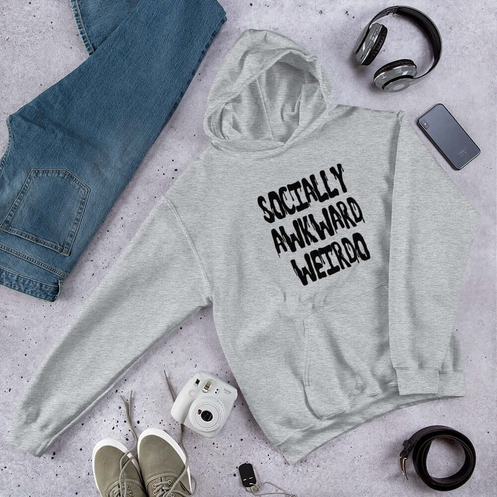 Sport grey hoodie sweatshirt with the words socially awkward weirdo printed on the front.