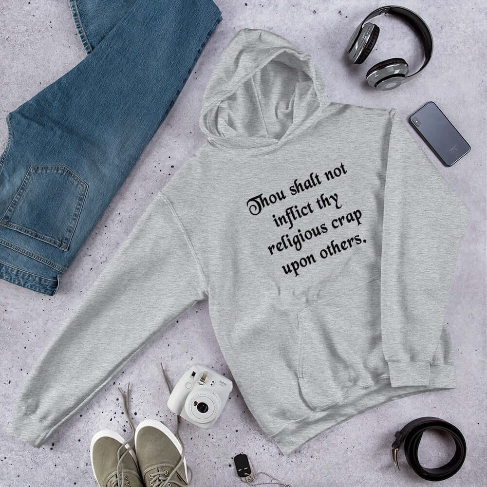 Light grey hoodie sweatshirt with the phrase Thou shalt not inflict thy religious crap upon others printed on the front.