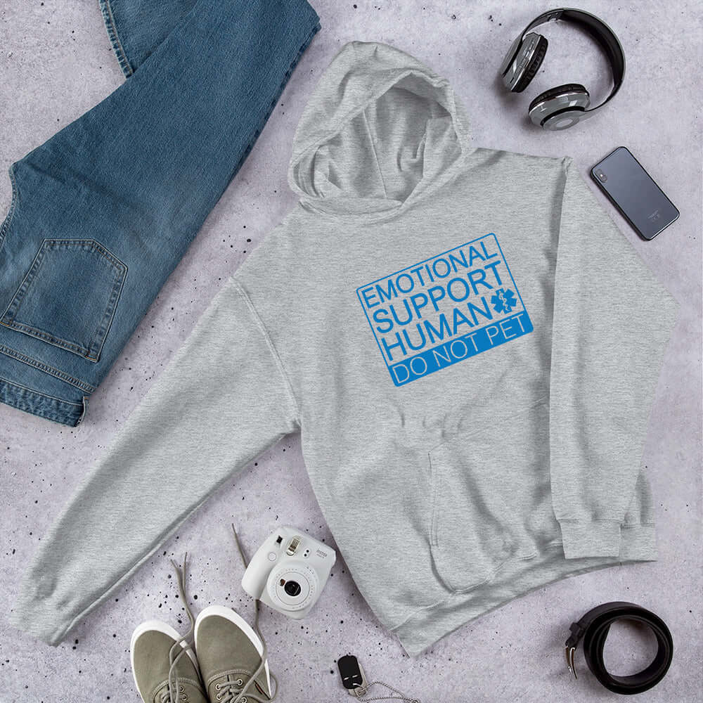 Light grey hoodie sweatshirt with the words Emotional support human, do not pet printed on the front. 