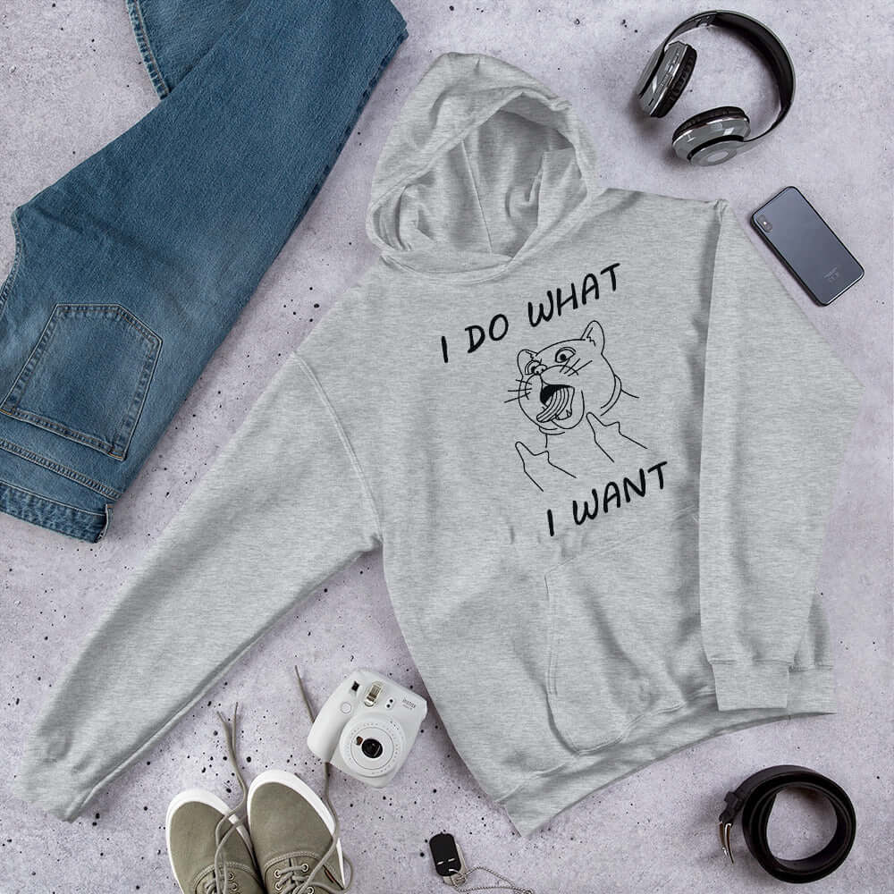 Light grey hooded sweatshirt with cat flipping middle fingers and the words I do what I want printed on the front.