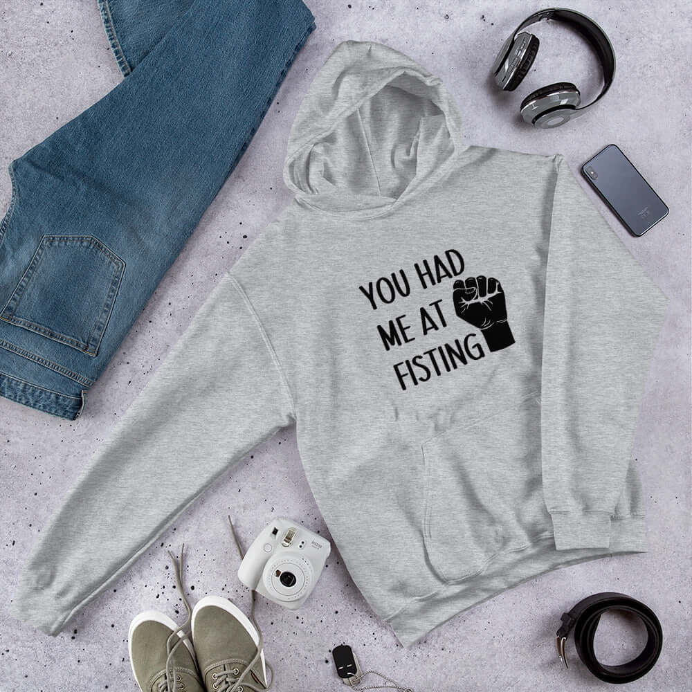 Light grey hooded sweatshirt with image of a fist and the words You had me at fisting printed on the front.