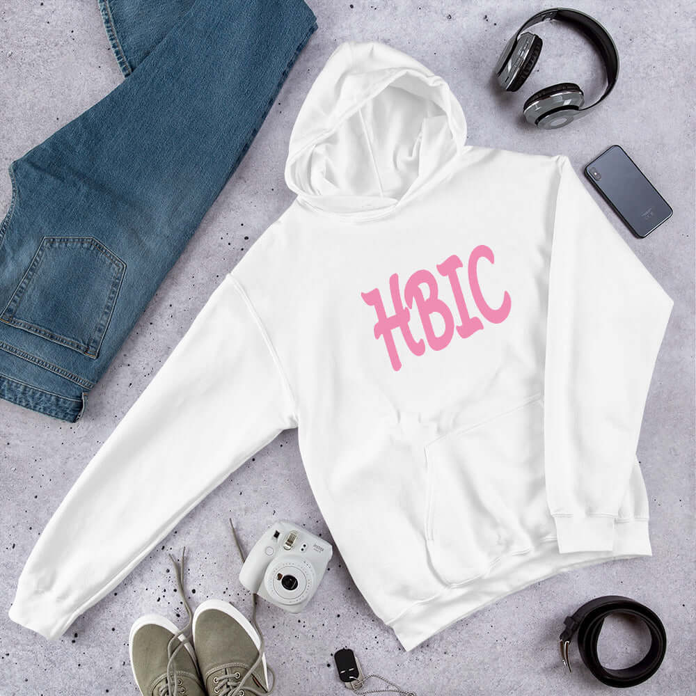 White hooded sweatshirt with the acronym HBIC printed on the front in pink text.