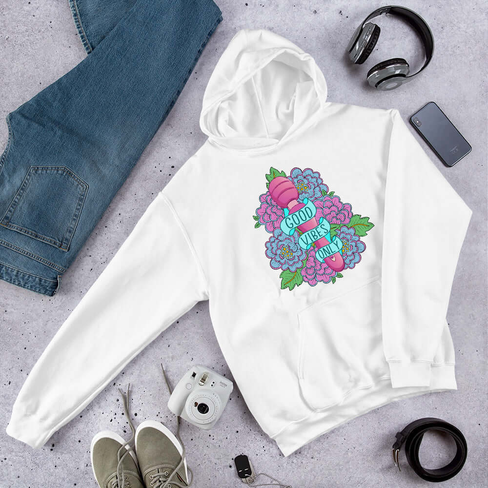 White hoodie sweatshirt with graphic design that has the words Good vibes only layered over a pink wand vibrator with flowers around. The graphic design is printed on the front of the hoodie.