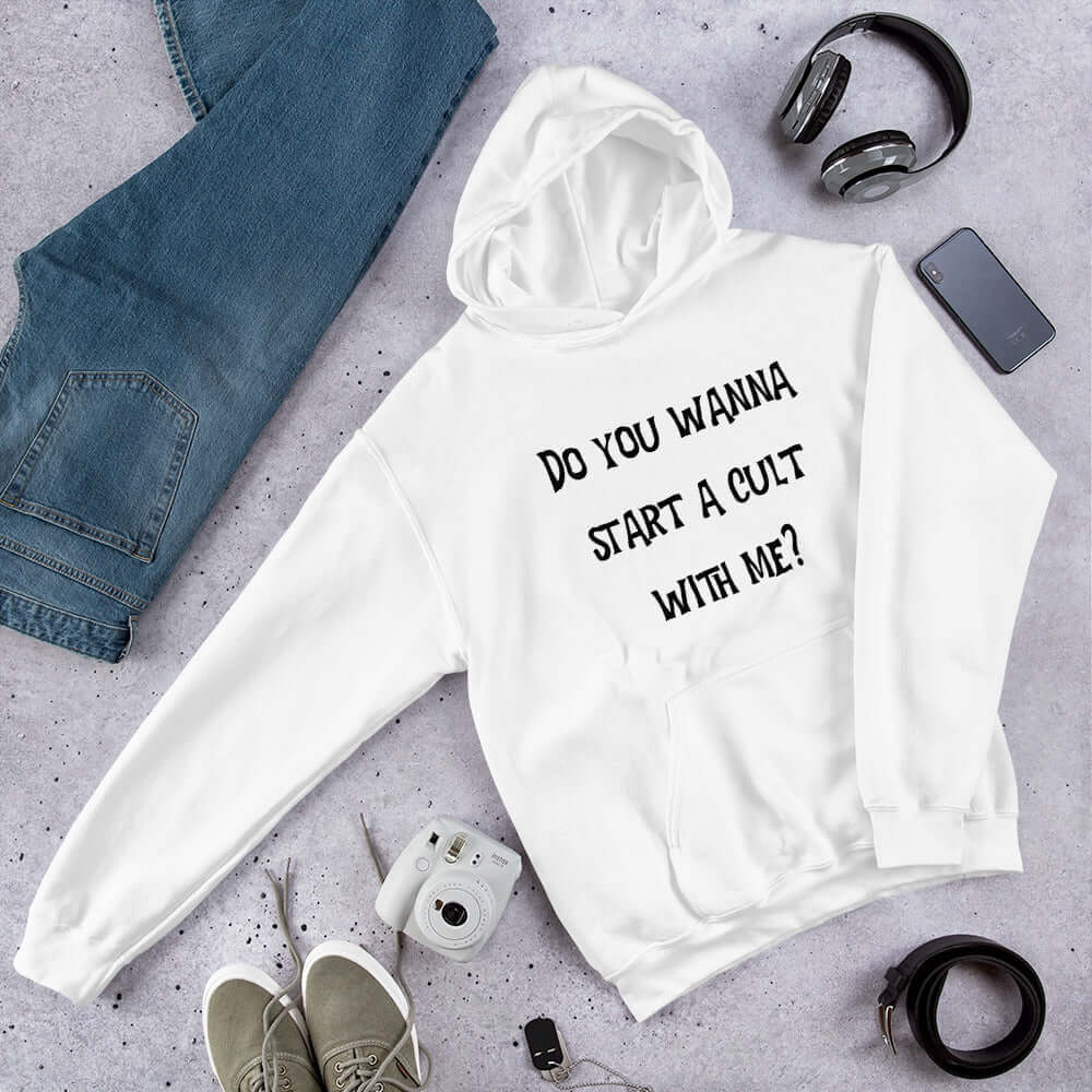 White hoodie sweatshirt with the words Do you want to start a cult with me printed on the front.