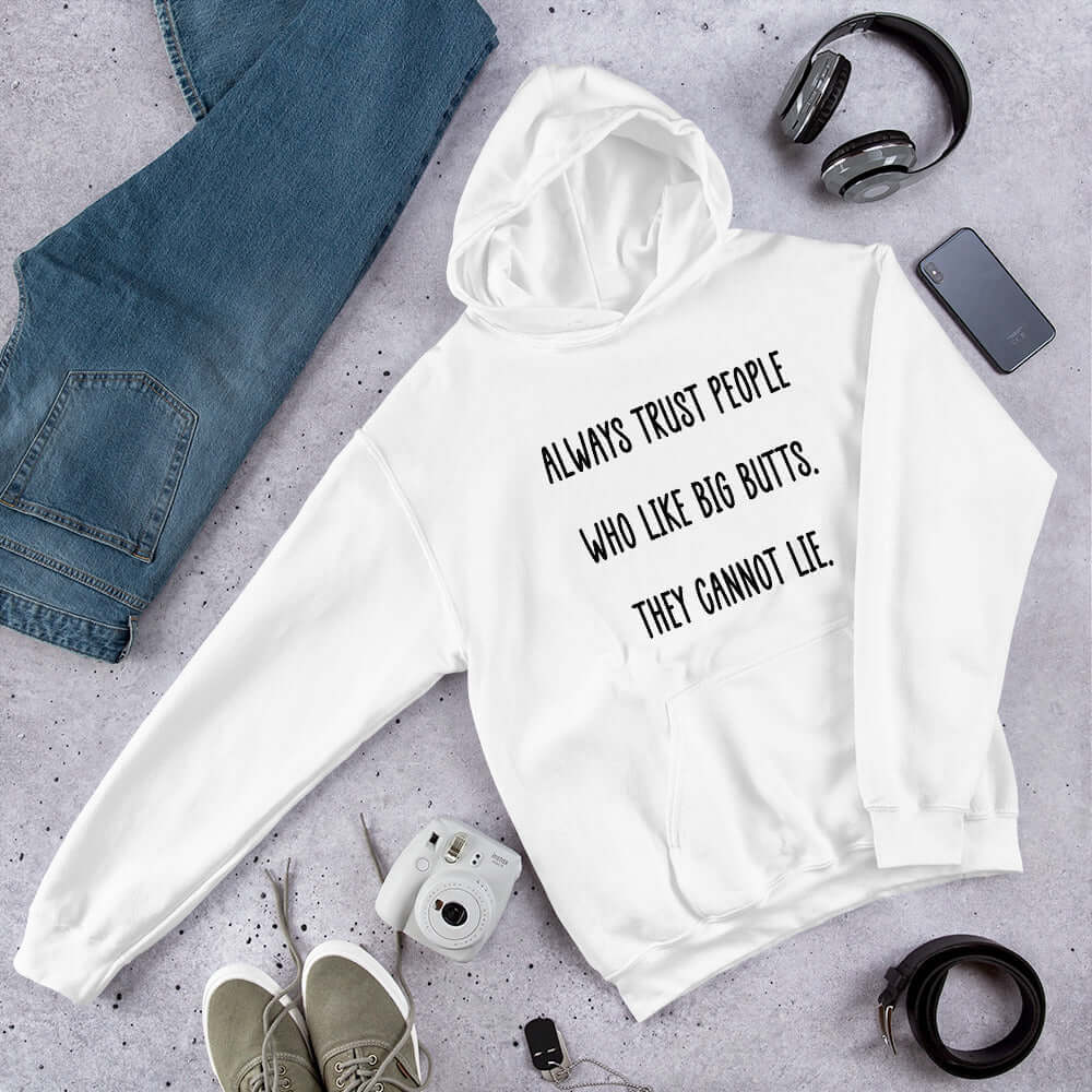 White hoodie sweatshirt with the funny phrase Always trust people who like big butts, they can not lie printed on the front.