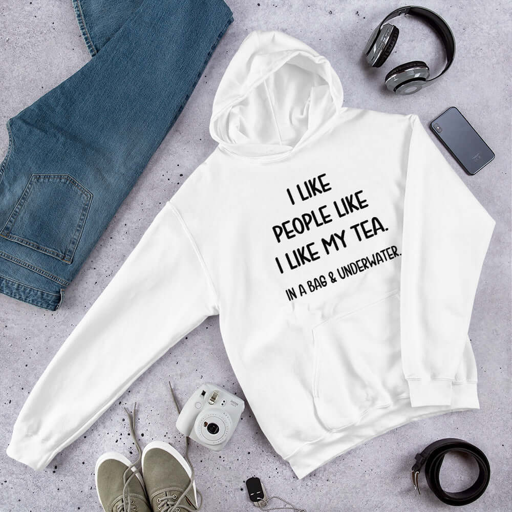White hoodie sweatshirt with the phrase I like people like I like my tea, In a bag & underwater printed on the front.