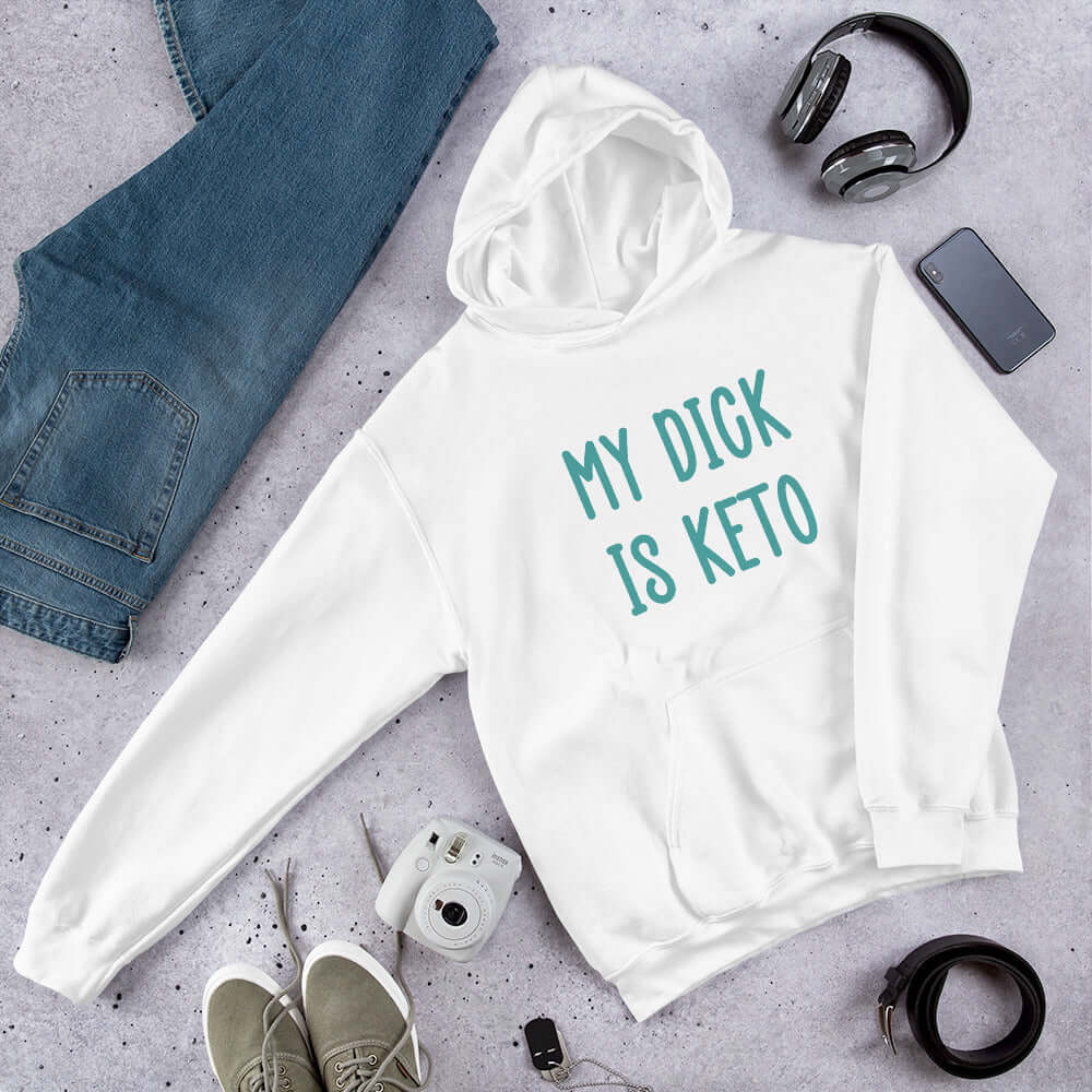 White hoodie sweatshirt with the phrase My dick is keto printed on the front in turquoise font.