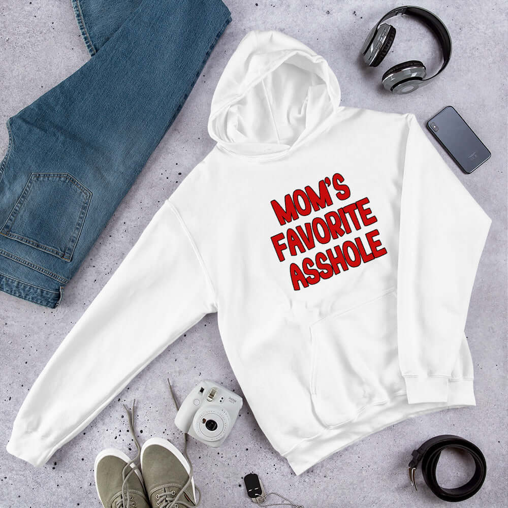 White hooded sweatshirt with the words Mom's favorite asshole printed in red on the front. 