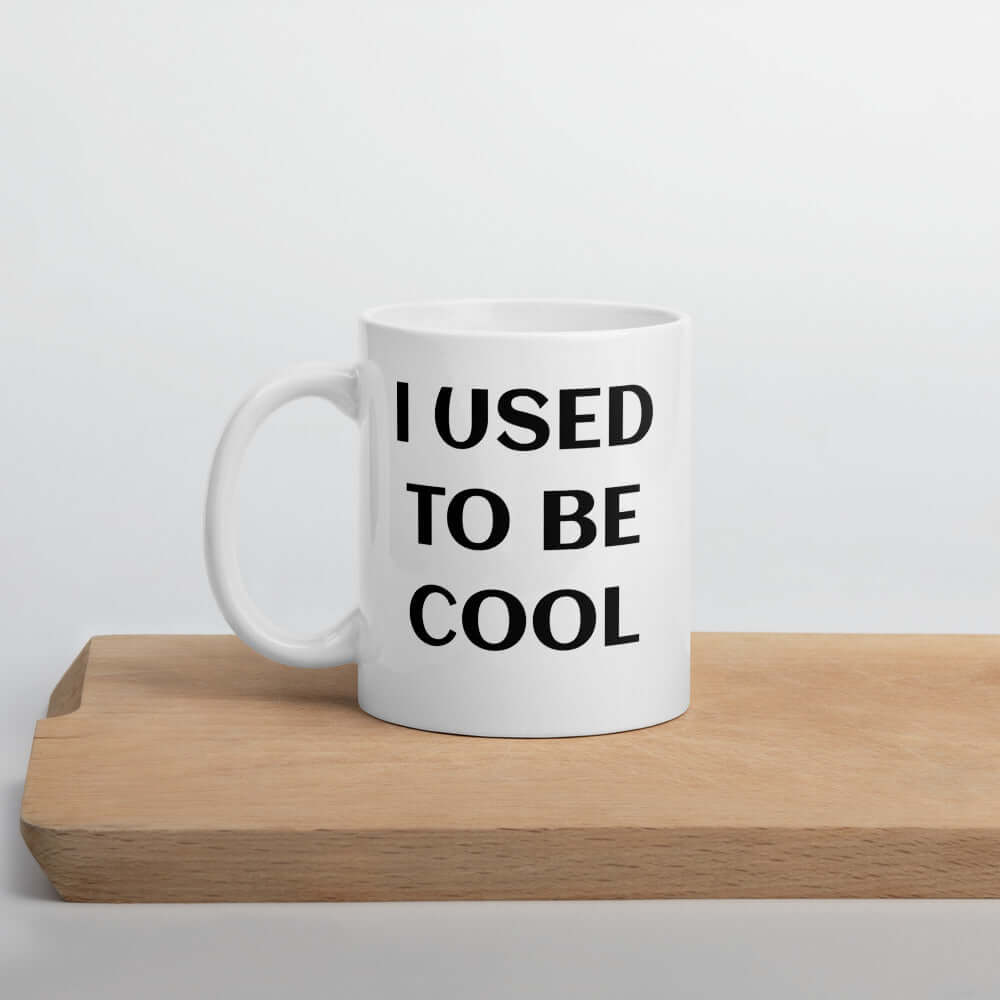 White ceramic mug with the phrase I used to be cool printed on both sides of the mug.